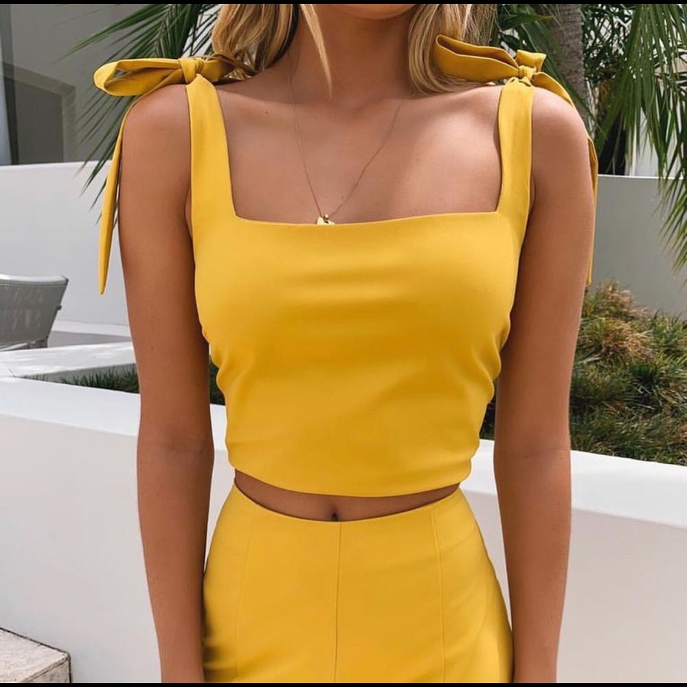 Yellow, never been worn Tigermist top